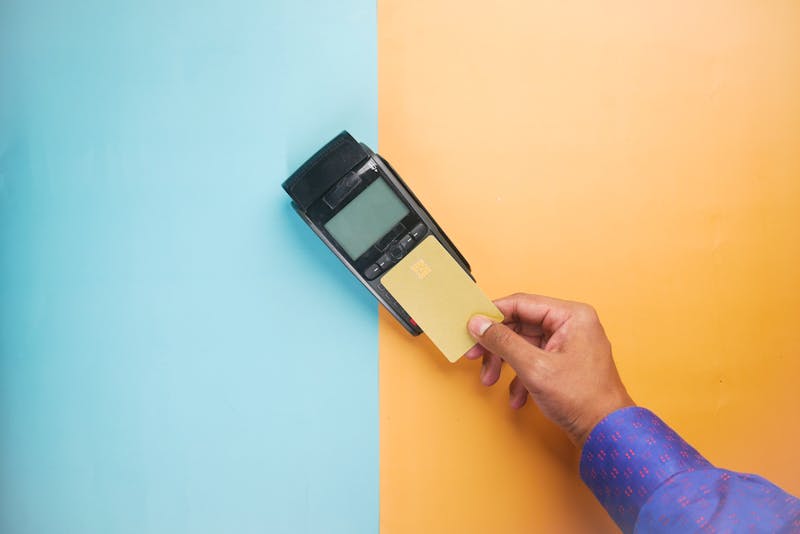 Customer tapping a card at a payment terminal